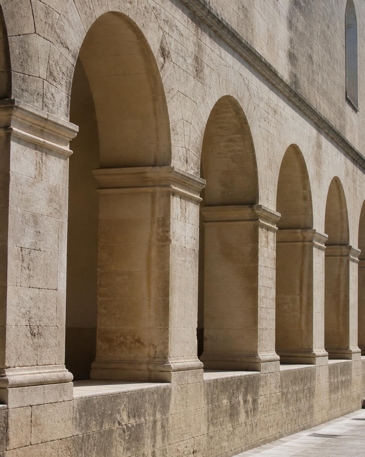Limestone colonnade of traditional Cypriot architecture in daylight